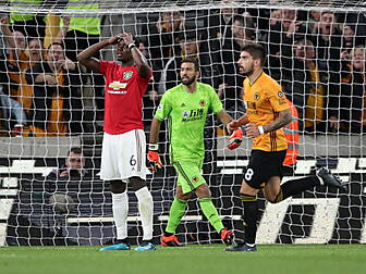 Pogba penalty miss as Wolves h...